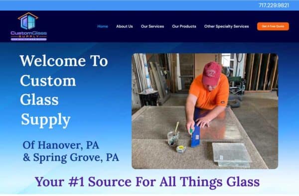 Screenshot from Custom Glass Supply’s website portfolio homepage shows a man in an orange shirt working with glass. Text reads “Welcome to Custom Glass Supply, Of Hanover, PA & Spring Grove, PA. Your #1 Source for All Things Glass.”.